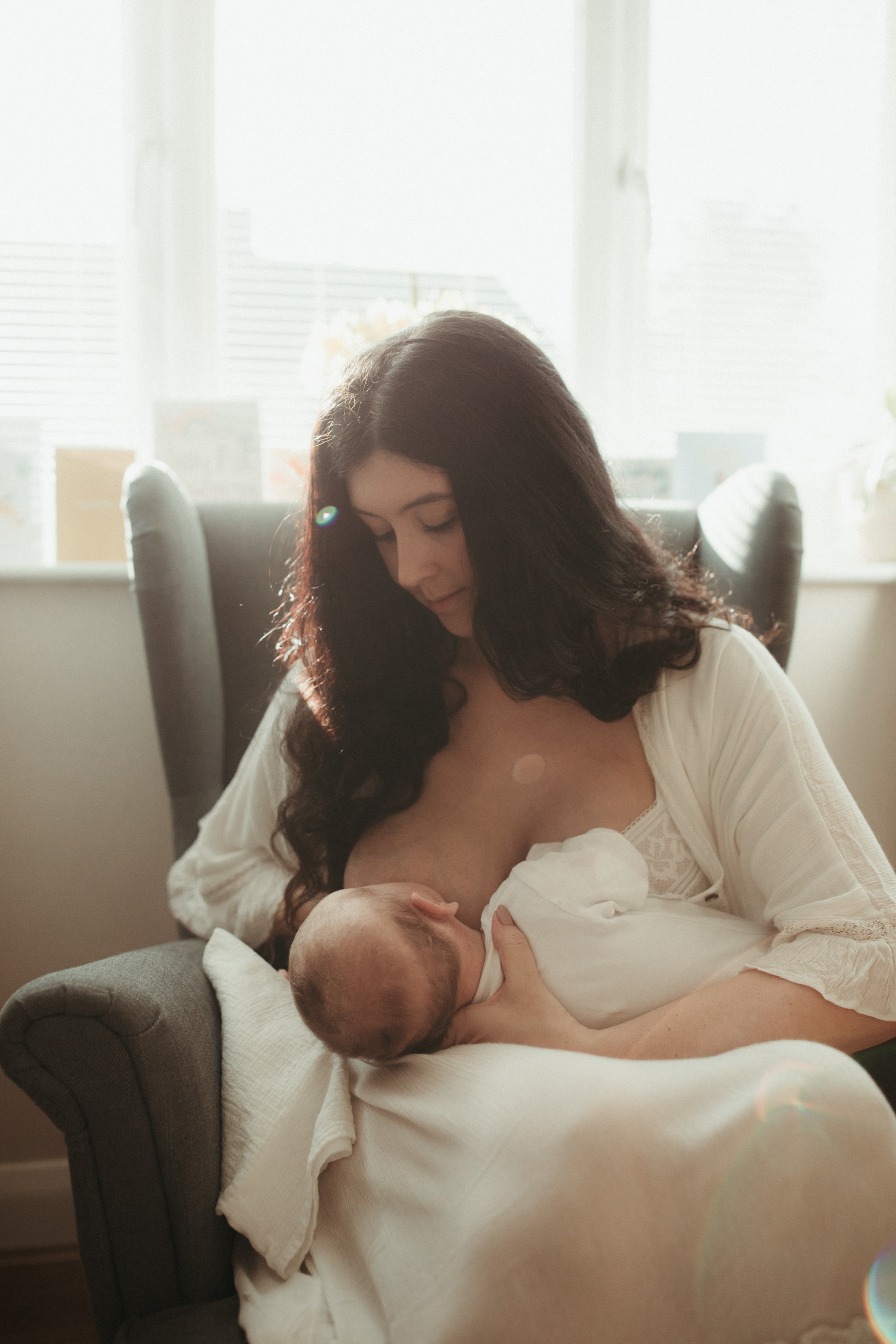new mother breastfeeding Maternity and Newborn Photographer Devon  
