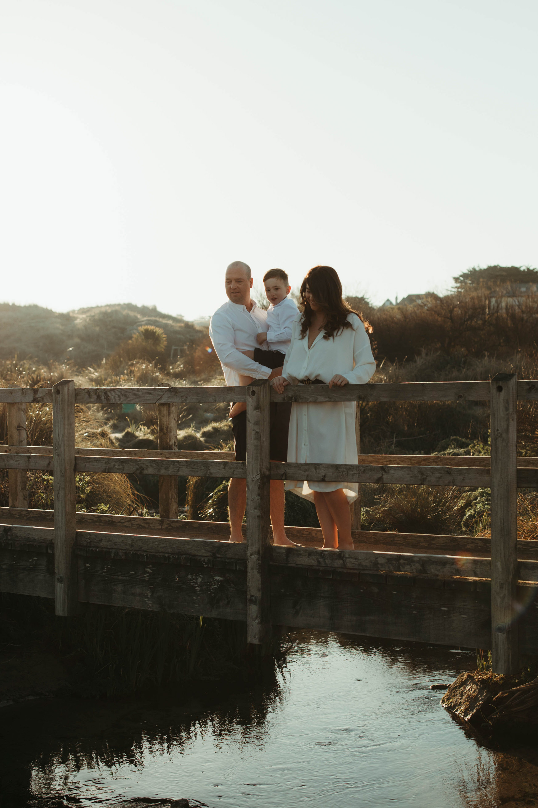 Family look over bridge at holywell bay Family Lifestyle Photography
